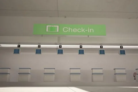 Flat design terminal is showing six check-in counters, monitors, green Check-in Stock Photos