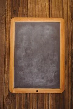 Flat design vector illustration is showing wood-framed chalkboard on rustic Stock Illustration