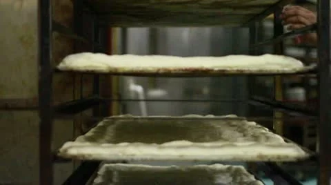 Flat dough MS moved to oven Stock Footage 9455299