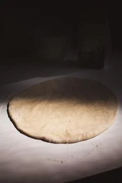 Flat Dough on Table In Shadow Stock Photos
