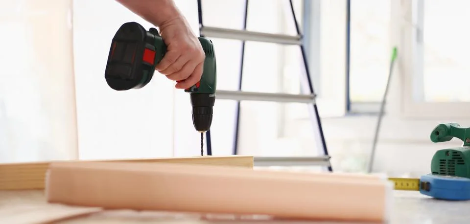 Flat drill bit make hole in wooden bar Stock Photos