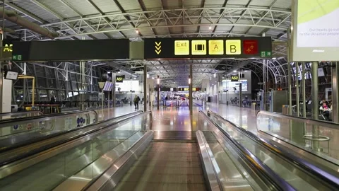 Flat escalator and  gate signage  at Zaventem Brussels International airport Stock Footage 198910631