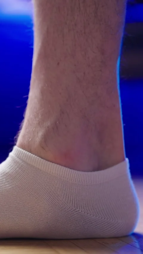Flat feet in socks step in frame slow motion Stock Footage 324134559
