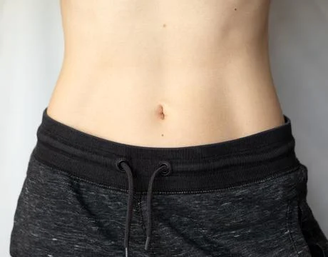 Flat female belly Stock Photos