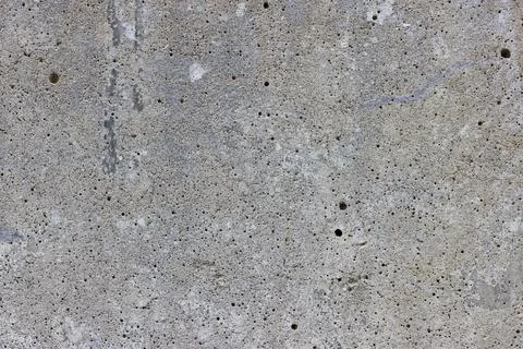 A flat grey concrete surface with lots of tiny air bubbles Stock Photos