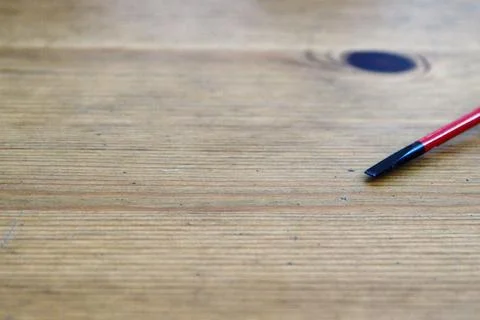 Flat head VDE screwdriver put on wood Stock Photos