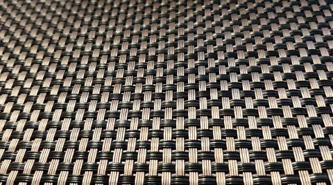 Flat interwoven strips of gray and black form an abstract background canvas Foto stock