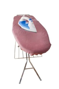 Flat iron on a ironing board Stock Photos