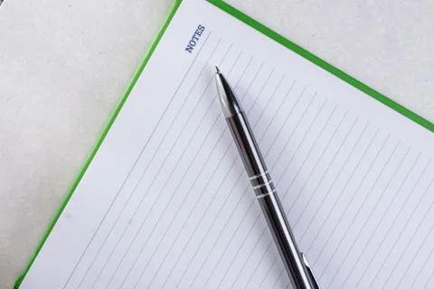Flat lay above business notes with pen on the white marble Stock Photos