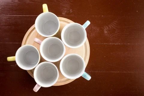 Flat lay above empty cups on the wooden board with copy space Stock Photos
