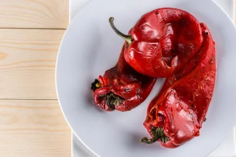 Flat lay above grilled fresh red paprika served on the plate with copy space Stock Photos
