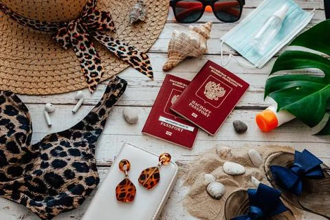Flat lay of accessories for summer beach holiday during covid-19 pandemic: pa Stock Photos