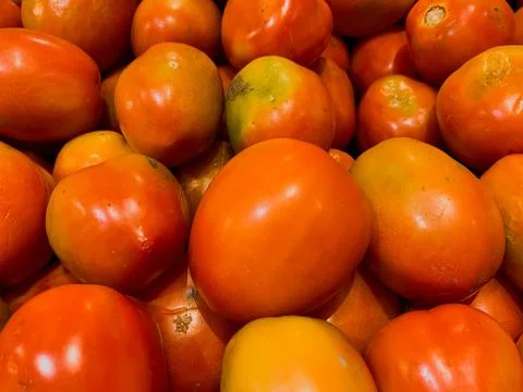 Flat Lay and Close-Up Views of Fresh Tomatoes in a Basket at a Supermarket Stock Photos