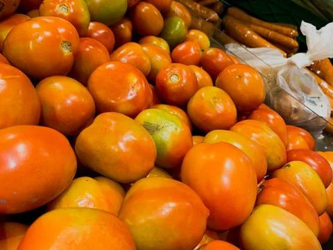 Flat Lay and Close-Up Views of Fresh Tomatoes in a Basket at a Supermarket Stock Photos