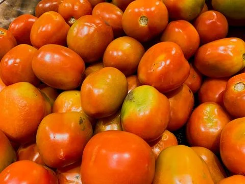 Flat Lay and Close-Up Views of Fresh Tomatoes in a Basket at a Supermarket Stock Photos