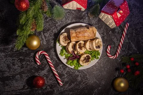 Flat lay appetizer of turkey or chicken meat with nuts and prunes on black .. Stock Photos