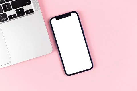 Flat lay Apple iPhone screen mockup, office desktop with laptop, bright pink  Stock Photos