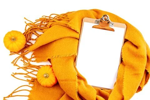 Flat lay autumn composition with notepad and a warm woolen scarf Fotos de archivo