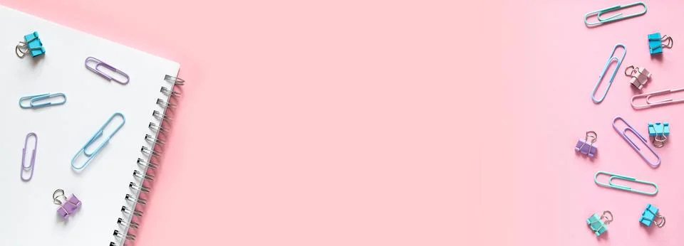 Flat lay back to school concept. Multi-colored paper clips Stock Photos