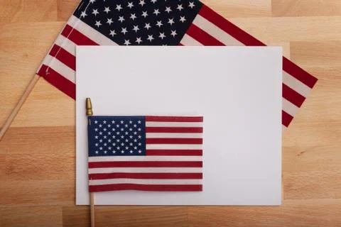 Flat lay background with blank white poster ready to add text american flags Stock Photos