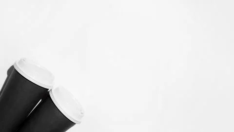 Flat lay banner with two disposable cups of coffee on a white background Stock Photos
