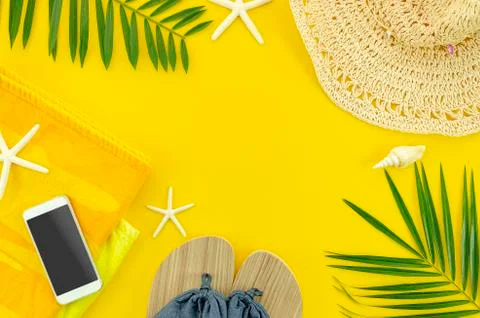 Flat lay beach accessories. Flyer with tropical palm leaf branches, towel Stock Photos