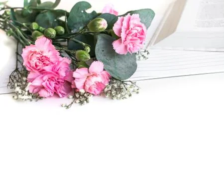 Flat lay: Bible and pink, red, rose flower bouquet Stock Photos