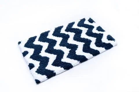 Flat lay, black and white color with zig zag pattern of microfiber bath mat i Stock Photos