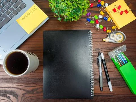 Flat lay, black book mock up. workspace in the background of the office desk Stock Photos
