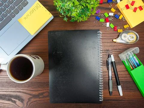 Flat lay, black book mock up. workspace in the background of the office desk Stock Photos