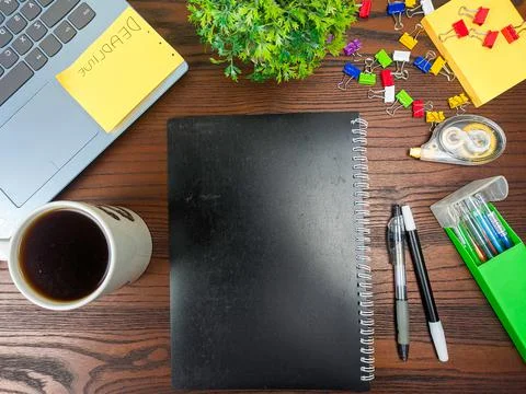 Flat lay, black book mock up. workspace in the background of the office desk Stock Photos