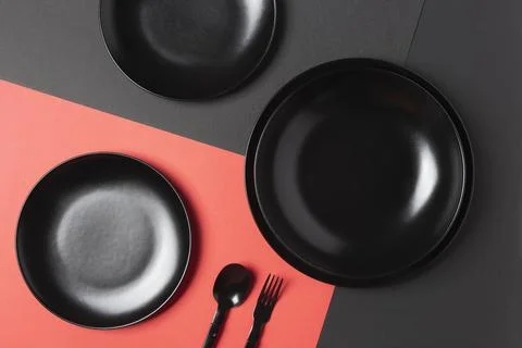 Flat lay black plates composition Stock Photos