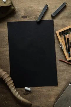 Flat lay with a black sheet of paper Stock Photos