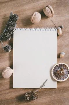 Flat lay of blank brown notebook on wooden table. Stock Photos