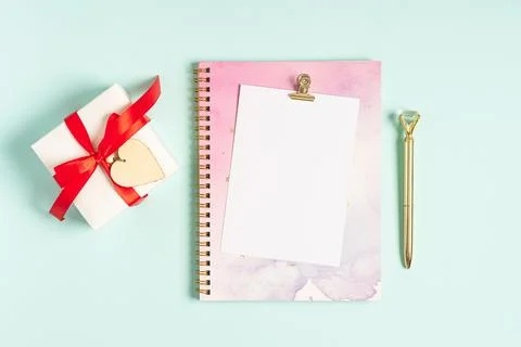 Flat lay of blank letter note pad with Valentine gift. Stock Photos