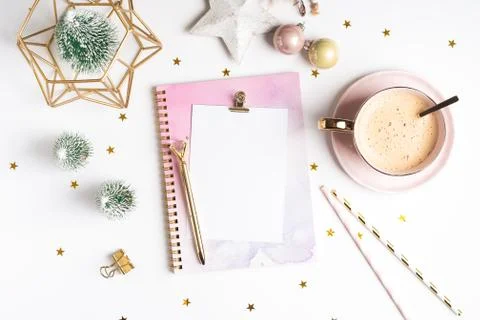 Flat lay of Blank notepad with cup of coffee and Christmas decoration. Stock Photos