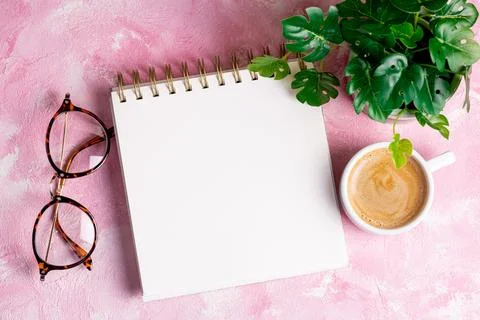 Flat lay of blank notepad on office desk table or workplace with coffee cup.. Stock Photos