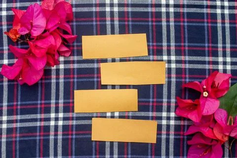 Flat Lay Blank Paper Notes with Pink Flowers on Plaid Textile Background Stock Photos