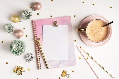 Flat lay of Blank planner with cup of coffee and Christmas decoration. Stock Photos