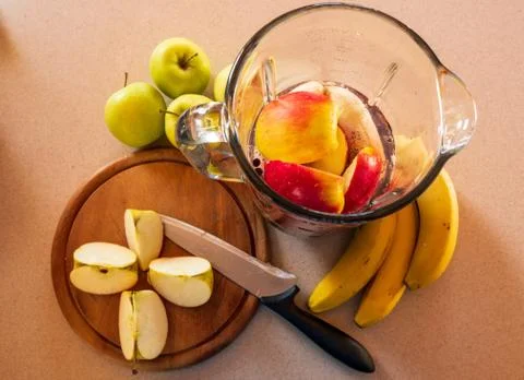 Flat-lay of a blender on a kitchen digital scale with blueberries and nuts, a Stock Photos