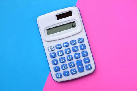 Flat lay A blue calculator on the two tone color blue and pink background Stock Photos