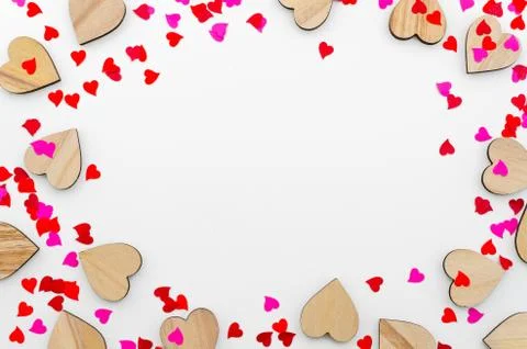 Flat lay border arrangement frame from wooden and felt hearts. Copy space for Stock Photos