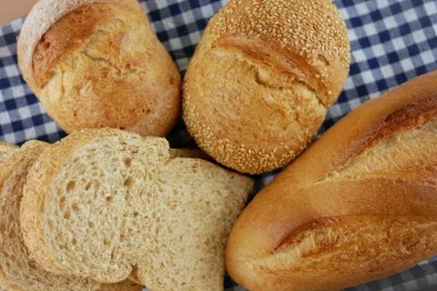 Flat lay breads on blue fabric Stock Photos