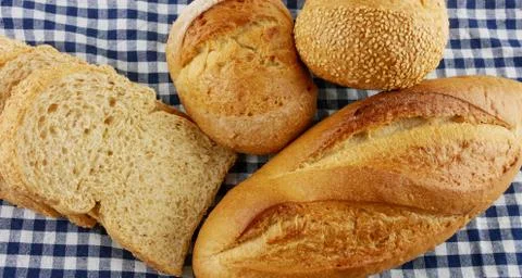 Flat lay breads on blue fabric Stock Photos