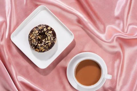 Flat lay of breakfast with donut and black coffee. Stock Photos