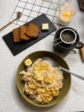 Flat lay breakfast with oatmeal, peanut paste and banana Stock Photos