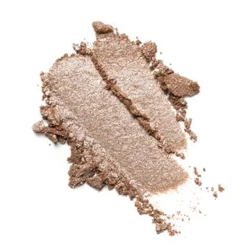 Flat lay of brush stroke. Broken shiny beige color eyeshadow as sample of cos Stock Photos