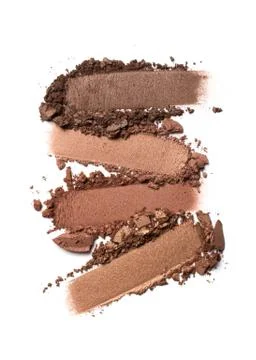 Flat lay of brush stroke. Broken brown or bronze color eyeshadow as sample of Stock Photos