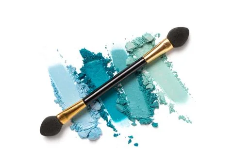 Flat lay of brush stroke. Broken bright eyeshadow as sample of cosmetic produ Stock Photos
