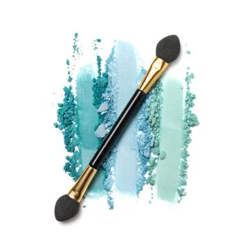 Flat lay of brush stroke. Broken bright eyeshadow as sample of cosmetic produ Stock Photos